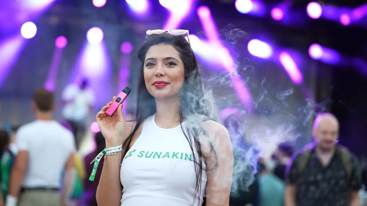 Event film preview — festival guest in front of a lit stage
