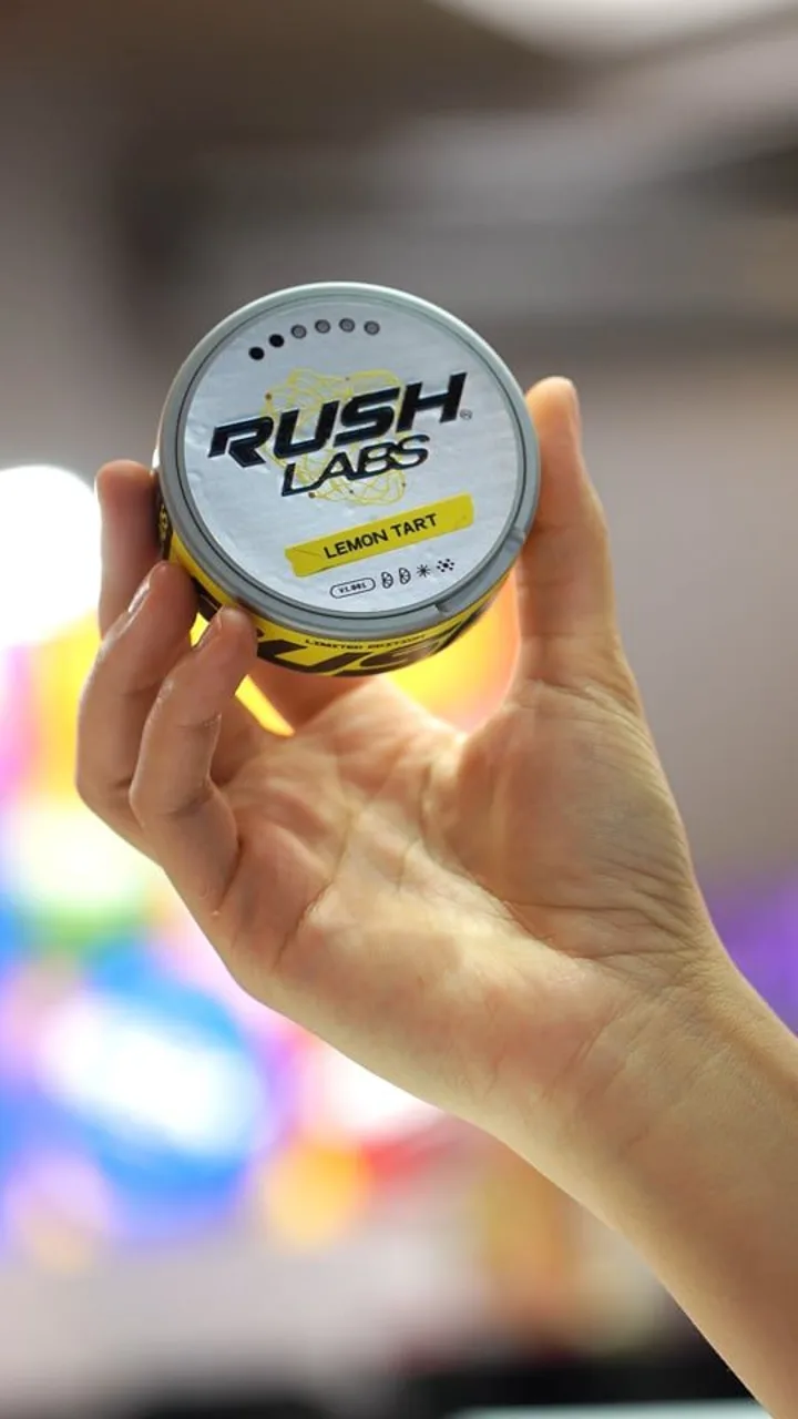 Rush product held up in front of the stand, vertical clip