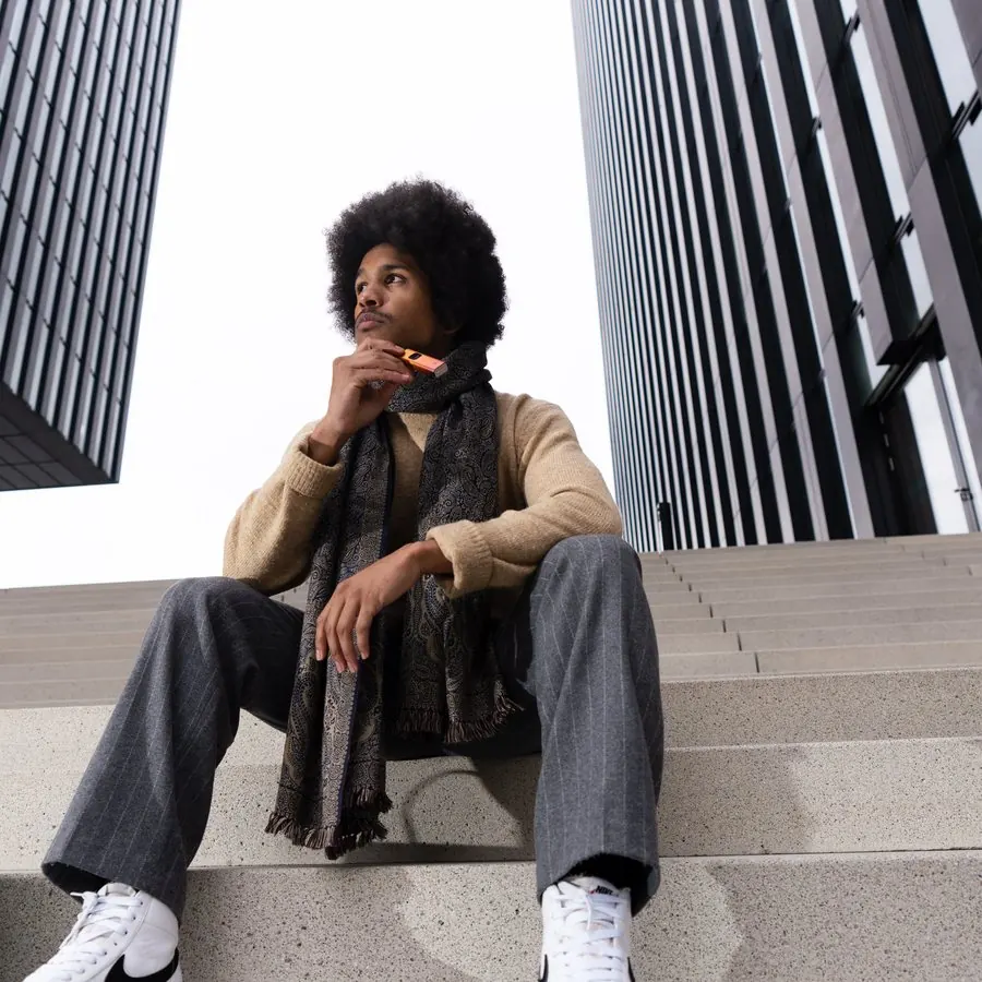 Lifestyle portrait on urban stairs between towers