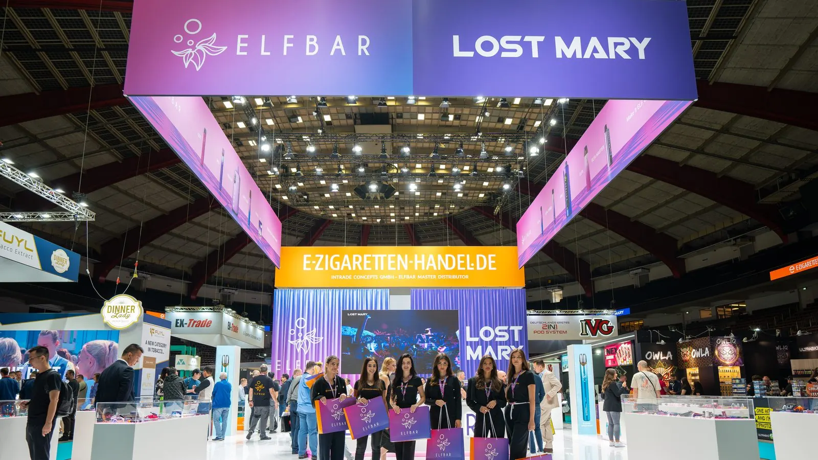 Trade show hall with large illuminated exhibition stands