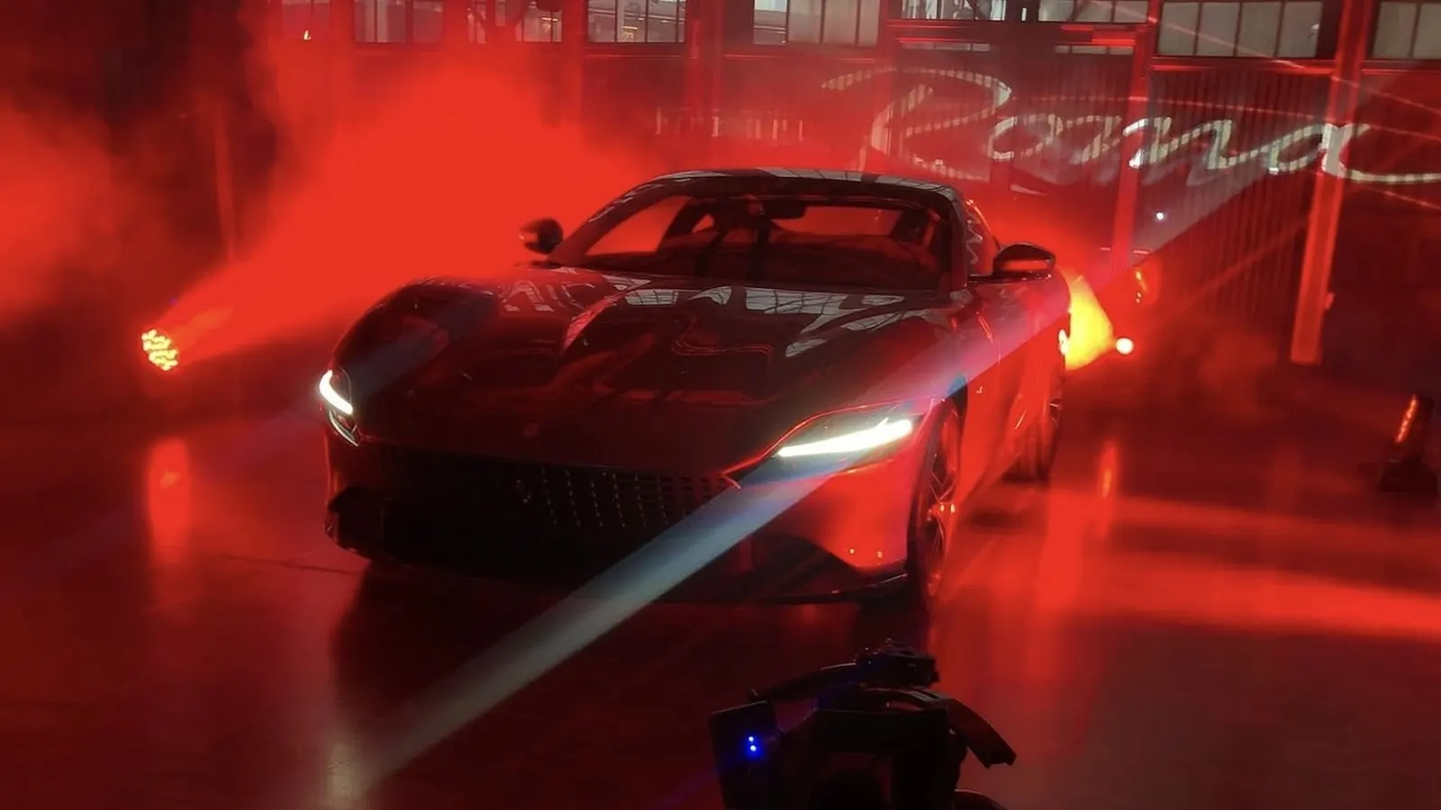 Sports car reveal in dramatic red light