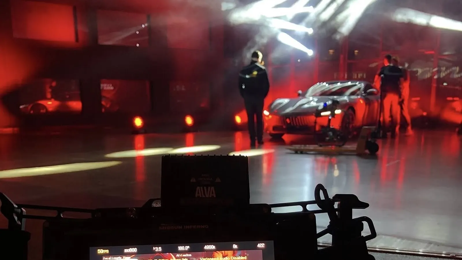 Behind the scenes of an automotive shoot in red light